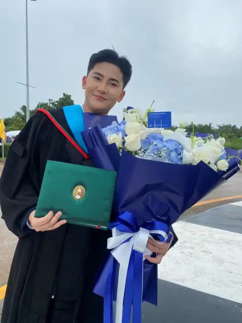 Namteo at her graduation ceremony with family and fans